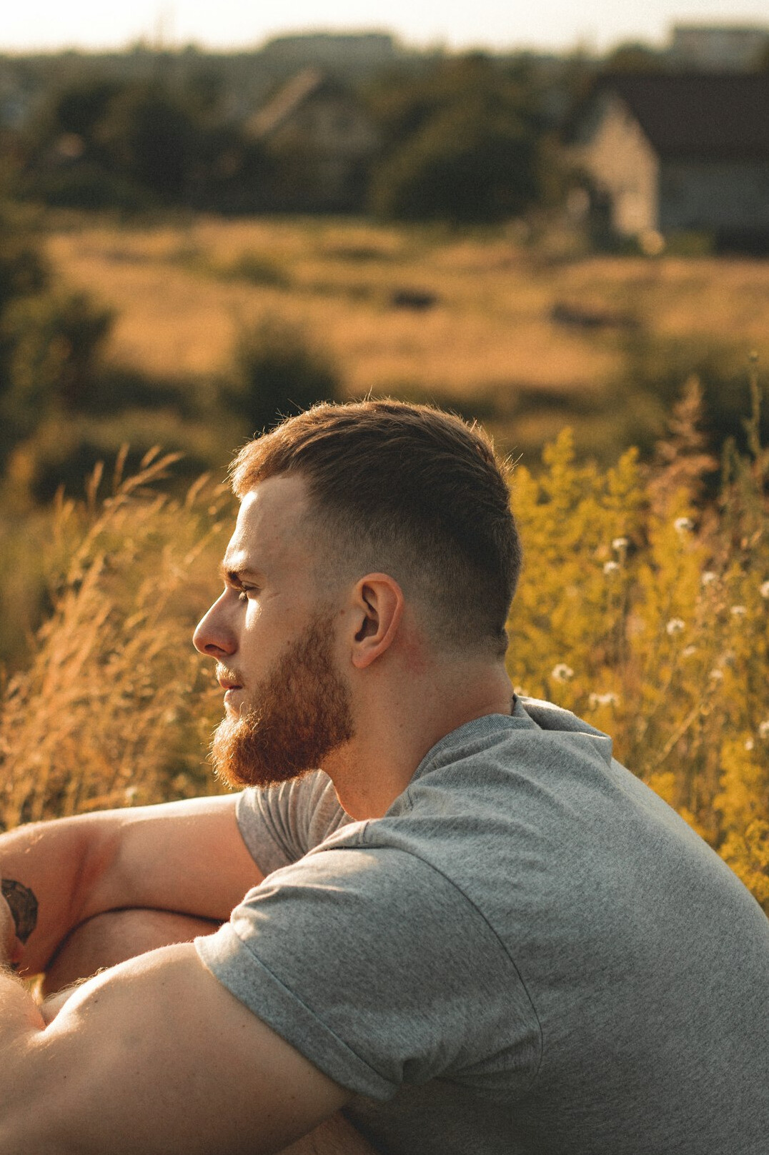 Portrait of a man with short hair and beard outdoors