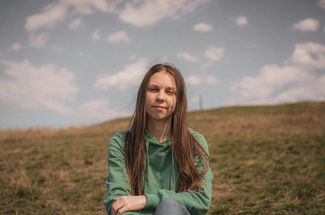 Portrait of a young woman with long hair smiling